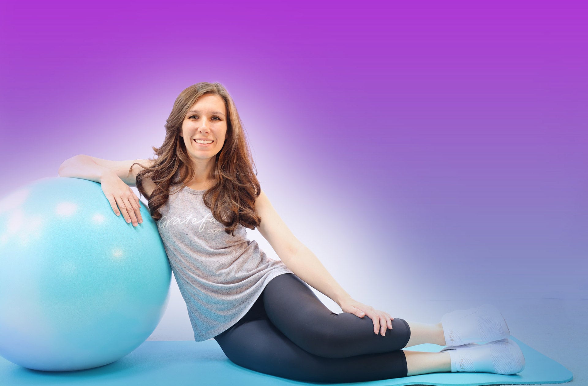 Sculptness Cover Photo of Ashley Brooke Sitting on Exercise Mat with Exercise Ball